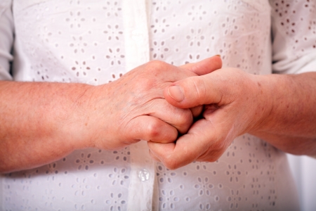 the hands of elderly woman are crossedの写真素材