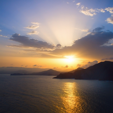 Summer view of the sea and mountain rangeの写真素材