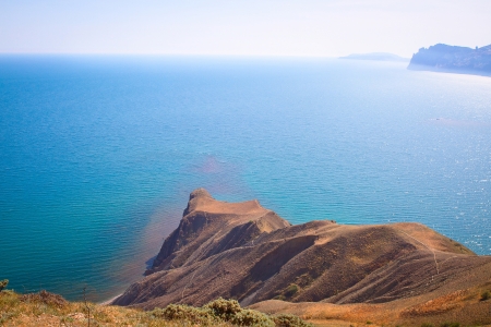 Summer view of the sea and mountain rangeの写真素材