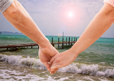 Happy couple holding handsの写真素材