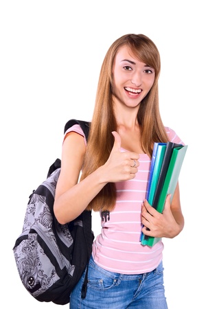 Beautiful female student holding notebook and smiling, isolated   Concept of successの写真素材