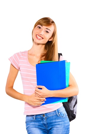 Beautiful female student holding notebook and smiling, isolated . Concept of successの写真素材