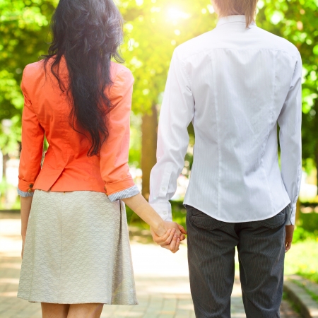 Happy couple holding handsの写真素材