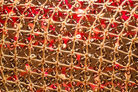 Red golden glowing background  Christmas card  Abstract background with bokeh defocused lights and starsの写真素材