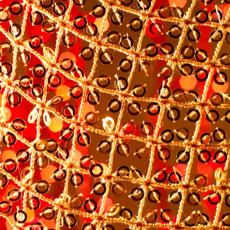 Red golden glowing background  Christmas card  Abstract background with bokeh defocused lights and starsの写真素材