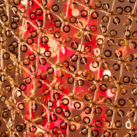 Red golden glowing background  Christmas card  Abstract background with bokeh defocused lights and starsの写真素材