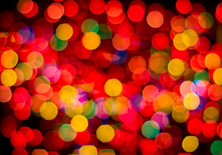 Multi-colored glowing background  Christmas card  Abstract background with bokeh defocused lights and starsの写真素材