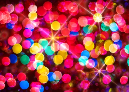 Multi-colored glowing background  Christmas card  Abstract background with bokeh defocused lights and starsの写真素材