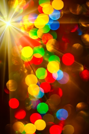 Multi-colored glowing background  Christmas card  Abstract background with bokeh defocused lights and starsの写真素材