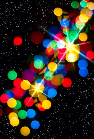 Multi-colored glowing background  Christmas card  Abstract background with bokeh defocused lights and starsの写真素材