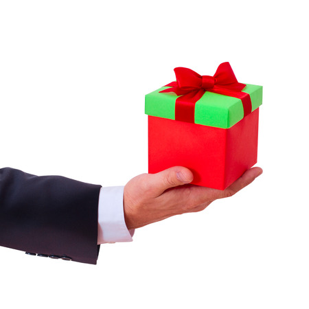 businessman holding  gift box with red bowの写真素材