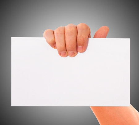 Advertising: Hand holding white empty paperの写真素材