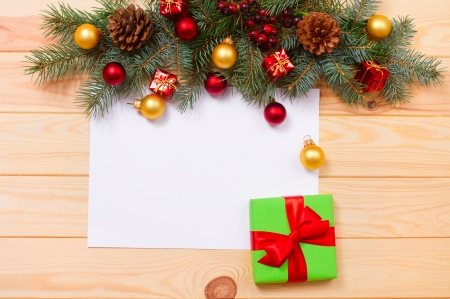 Christmas card. Vintage gift box (package) with blank gift tag on old wooden background.の写真素材