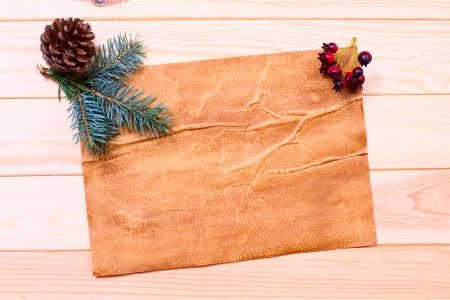 Christmas card. Vintage gift box (package) with blank gift tag on old wooden background.の写真素材