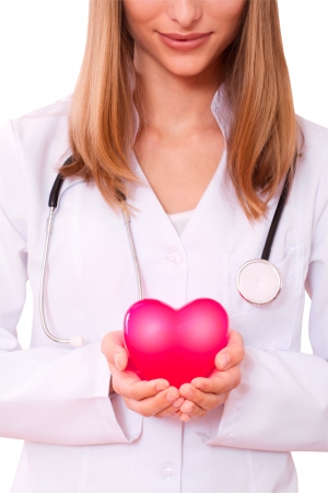 Female doctor holding a heart  the concept of health insurance, life insuranceの写真素材