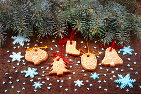 Gingerbread cookies hanging over wooden . Christmas cardの写真素材