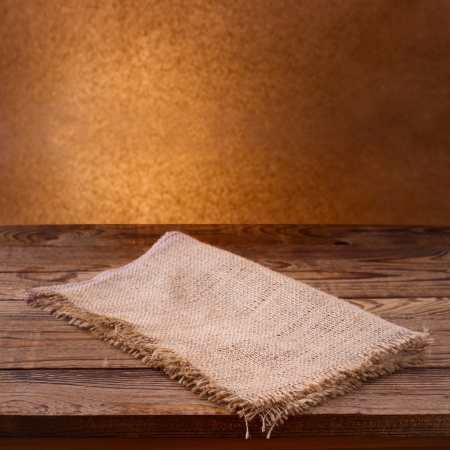Empty wooden deck table with tablecloth  Free space for your textの写真素材
