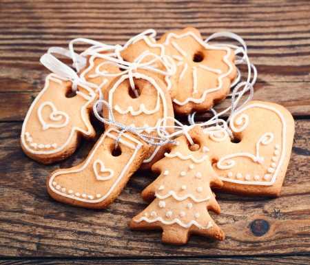 Gingerbread cookies on wooden background. Christmas card. Free space for your textの写真素材