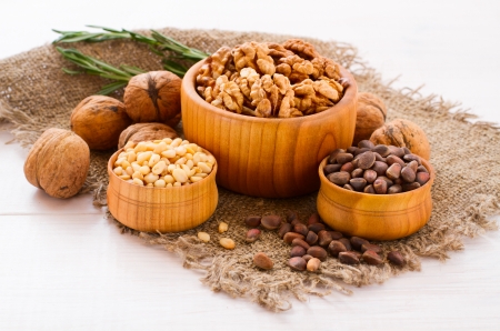Hazelnuts, filbert on old wooden background closeupの写真素材