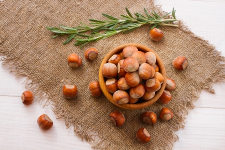 Hazelnuts, filbert on old wooden background closeupの写真素材