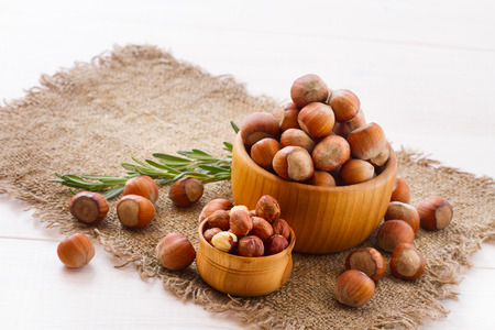 Hazelnuts, filbert on old wooden background closeupの写真素材