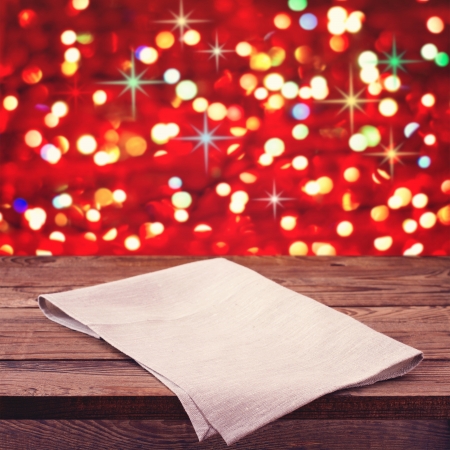 Background with wooden board over grunge background. Festive Christmas lights blurredの写真素材