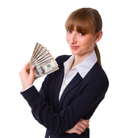 Happy business woman holding cash dollars in the hands of welcoming smile. The concept of finance success. Isolated, space for textの写真素材