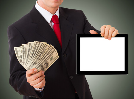 businessman giving cash dollars in  hands of passing them to the client. Concept of finance success. Isolated, space for textの写真素材