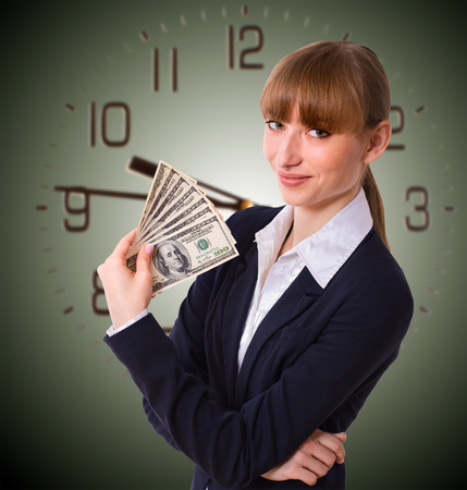 Happy business woman holding cash dollars in the hands of welcoming smile. The concept of finance success. Isolated, space for textの写真素材