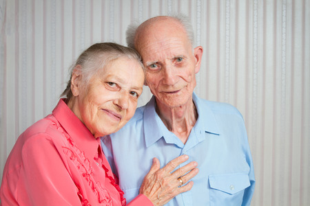 Senior Man, Woman with their Caregiver at Home  Concept of Health Care for Elderly Old People, Disabledの写真素材