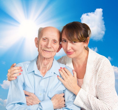 Senior Man, Woman with their Caregiver at Home  Concept of Health Care for Elderly Old People, Disabledの写真素材