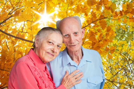 Closeup portrait of  smiling elderly couple Old people holding hands の写真素材