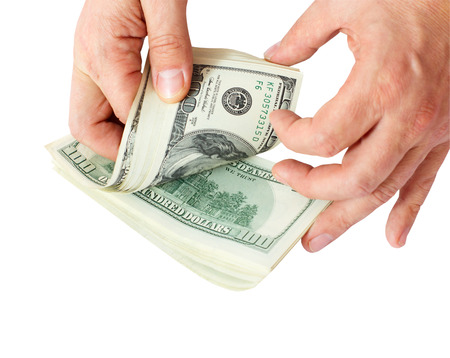 businessman giving money cash dollars in  hands of passing them to the client  Concept of time is money  Isolated, space for textの写真素材
