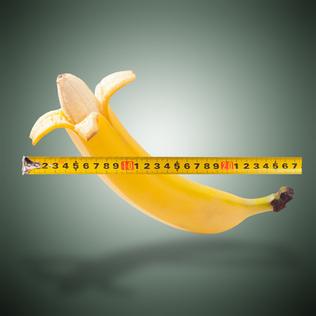 Large banana and measuring tapeの写真素材