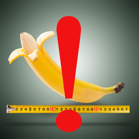 Large banana and measuring tapeの写真素材