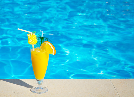 Delicious fresh orange juice near the pool on a tropical resortの写真素材