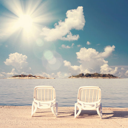 Beach two chairs on sand beach. Concept for rest, relaxation, holidays, spa, resort.の写真素材