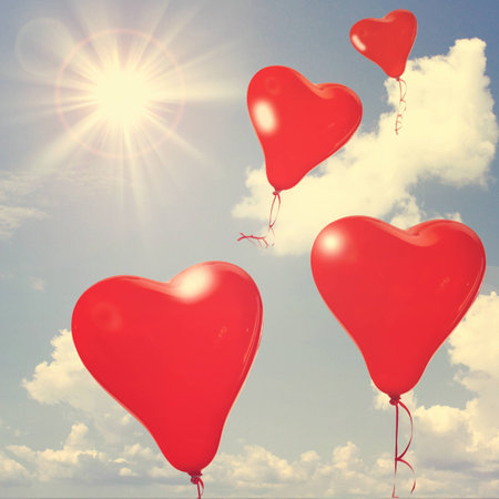 Retro love balloons on blue skyの写真素材