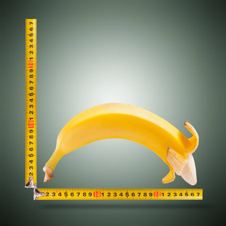 Large banana and measuring tapeの写真素材