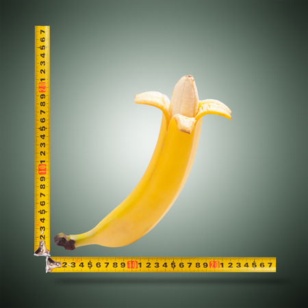 Large banana and measuring tapeの写真素材