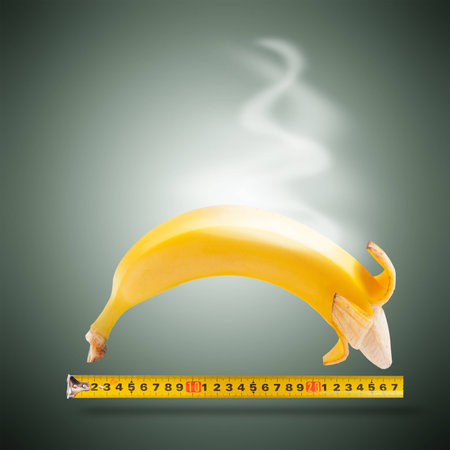 Large banana and measuring tapeの写真素材