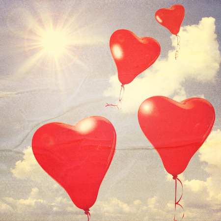 Retro love balloons on blue skyの写真素材