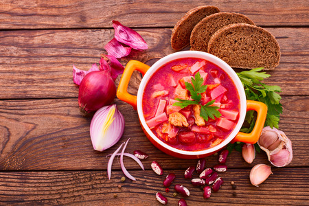 Ukrainian and Russian national Red Borsch with Bread closeup on Old Wooden Surface. Spices.の写真素材