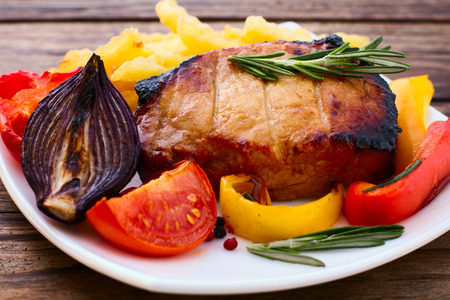 Food. Meat barbecue with vegetables on wooden surface. Meat steak. Beef steak bbq. Tomatoes, peppers, spices for cooking meat.の写真素材