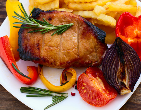 Beef steak bbq. Tomatoes, peppers, spices for cooking meat.の写真素材