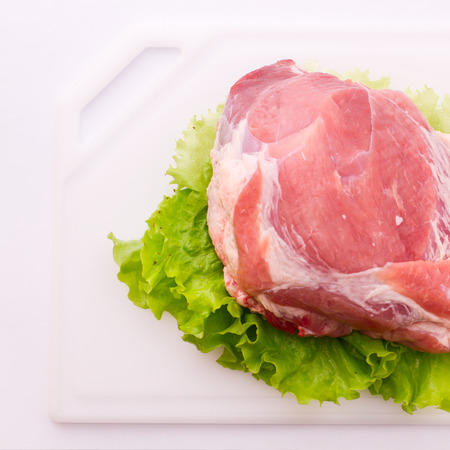 Food. Sliced pieces of raw meat for barbecue on white surface. Meat raw steak. Beef steak bbq. Spices for cooking meat.の写真素材