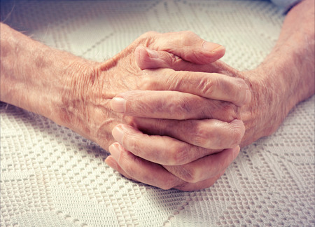 Care is at home of elderly  Old people holding hands closeup  Elderly man の写真素材