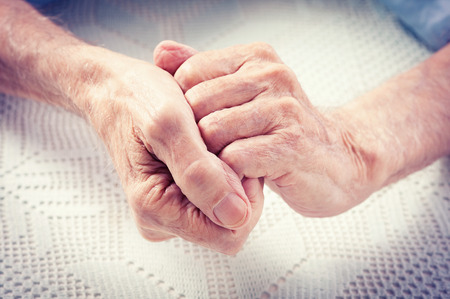 Care is at home of elderly  Old people holding hands closeup  Elderly man の写真素材