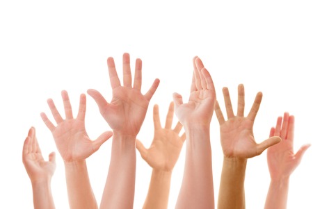 Raised up hands of many people isolatedの写真素材
