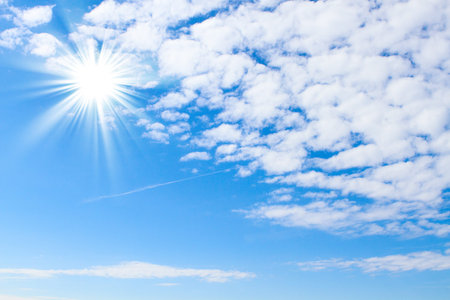 Blue sky with sun and beautiful clouds  for product montage texture background wallpaper. Stand for...
